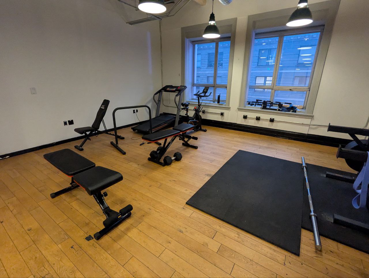 Gym area with benches and stationary bike